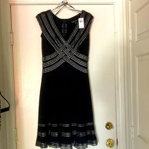 Tadashi Shoji dress. Never warn. Size small. In black. Stretchy fabric